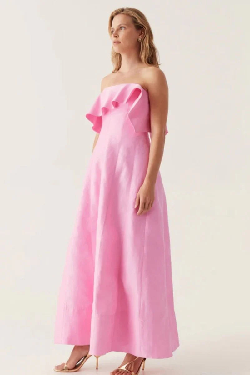 The AJE Shallows Strapless Gown epitomizes contemporary elegance with its minimalist silhouette and refined construction. This strapless design features a structured bodice that provides confident support while maintaining a sleek, uninterrupted neckline. The gown's clean lines and sophisticated draping create a timeless aesthetic suitable for formal occasions, evening events, or statement-making moments.