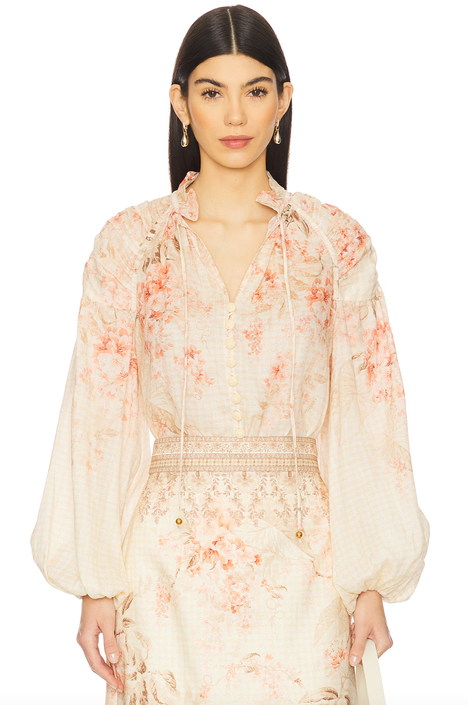 This blouse crafted from breathable linen offers a comfortable, lightweight feel ideal for warmer days. Featuring a front button placket with loops and a stylish front lace-up detail, it combines classic design with a contemporary touch. Elastic cuffs ensure a secure yet flexible fit at the sleeves. For optimal care, professional dry cleaning is recommended to preserve the fabric’s quality and shape.