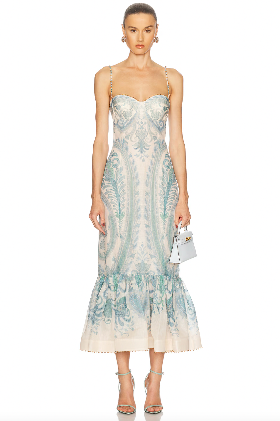 The Illuminate Gown by Zimmermann features a fully lined bustier design that ensures a flattering fit and comfortable wear. Its hidden back zipper closure offers a sleek silhouette, while adjustable shoulder straps provide customizable support. Crafted from premium linen, the gown combines breathable comfort with a structured skirt detail, lending an elegant and refined shape suitable for sophisticated occasions.