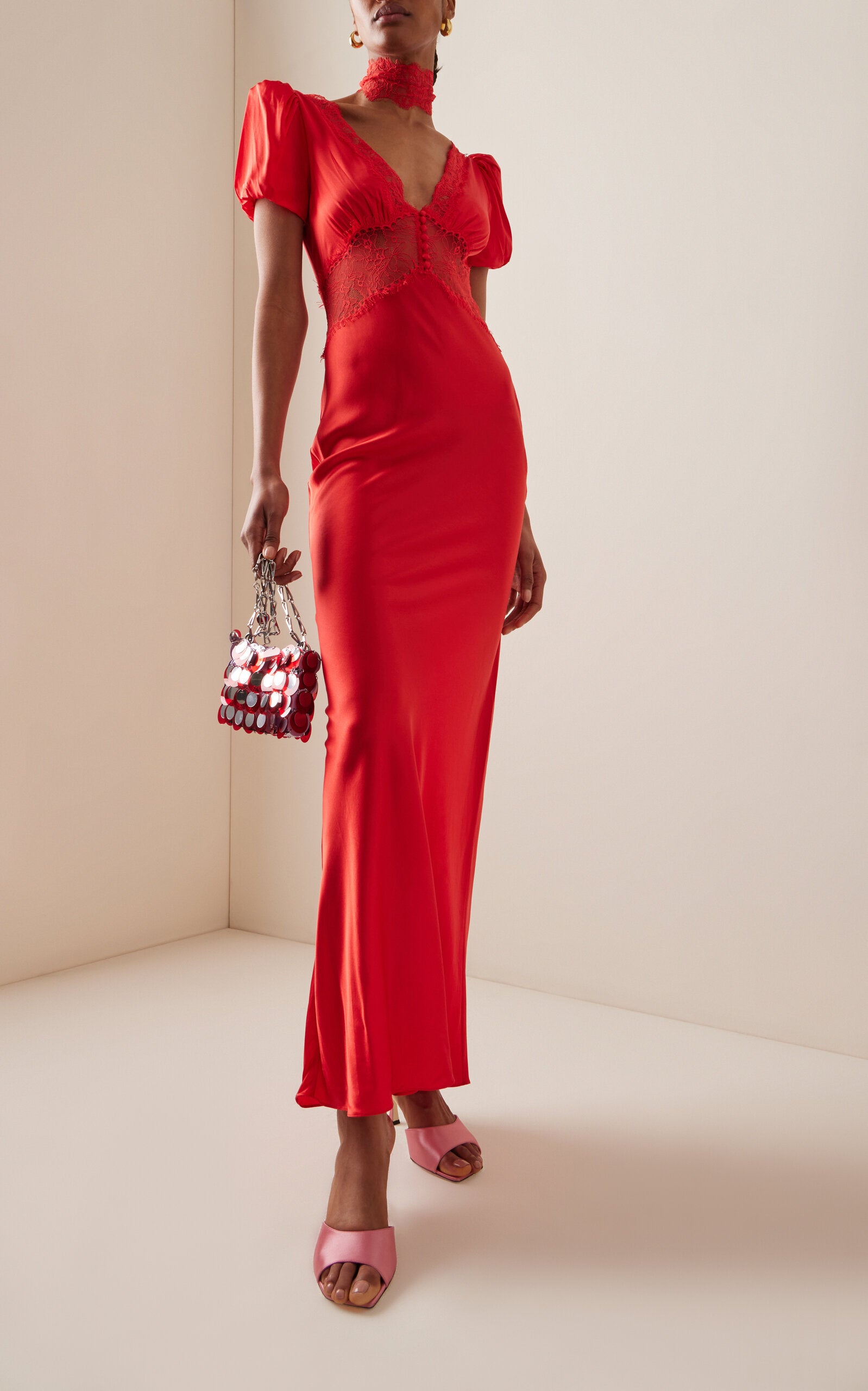 The Pavlova Lace-Trimmed Silk-Blend Maxi Dress from De La Vali channels the spirit of muse Vali Myers through its elegant design. Crafted from a luxurious silk blend, this maxi dress features delicate lace trimming that adds a refined touch. Its flowing silhouette empowers the wearer with effortless confidence, making it a statement piece that combines artistry with wearable sophistication. Perfect for those who embrace bold elegance with a bohemian edge.