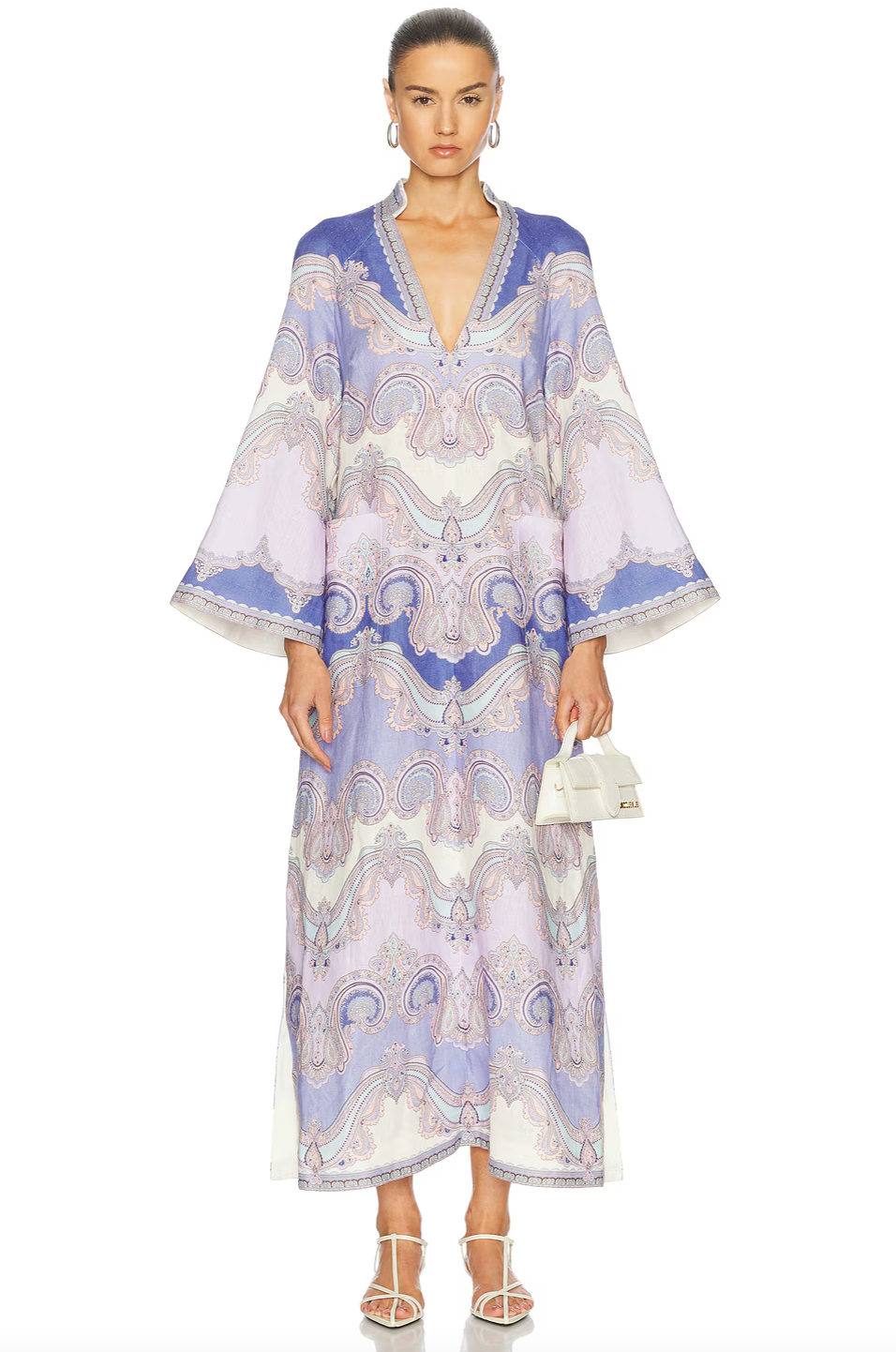 Elevate your wardrobe with the Maxine Midi Dress in delicate light purple by Zimmermann. Expertly designed with a plunging V-neckline and discreet rear zip, it offers both sophistication and comfort. Practical front patch pockets blend seamlessly with the refined silhouette, while side slits provide fluid movement and effortless elegance. Ideal for those seeking a polished look with functional details at any event.