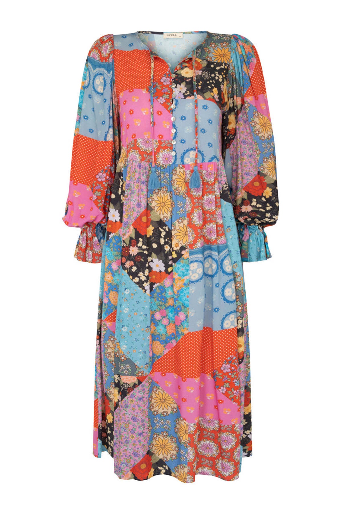 The Cha Cha Boho Midi Dress by Spell offers effortless style with its unlined, lightweight, and airy fabric, perfect for warm weather. It features a convenient pull-on design complemented by a partial front button closure for easy wear. The tie detail at the neckline with tasseled ends adds a delicate bohemian touch, while the cinched ruffled cuffs enhance the dress's feminine silhouette. This dress blends comfort and sophisticated design, ideal for those seeking a breathable, stylish wardrobe staple.