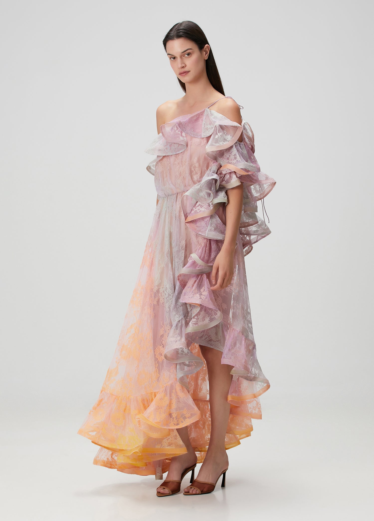 This elegant maxi dress features a distinctive one-shoulder design with an asymmetric neckline that adds a modern touch. Crafted from delicate lace, it offers a refined texture enhanced by flounced detailing and a laced shoulder strap for added sophistication. Perfect for formal occasions, its flowing silhouette ensures graceful movement while highlighting your poise and style.