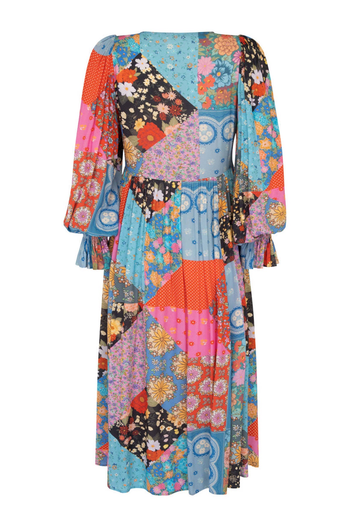 The Cha Cha Boho Midi Dress by Spell offers effortless style with its unlined, lightweight, and airy fabric, perfect for warm weather. It features a convenient pull-on design complemented by a partial front button closure for easy wear. The tie detail at the neckline with tasseled ends adds a delicate bohemian touch, while the cinched ruffled cuffs enhance the dress's feminine silhouette. This dress blends comfort and sophisticated design, ideal for those seeking a breathable, stylish wardrobe staple.