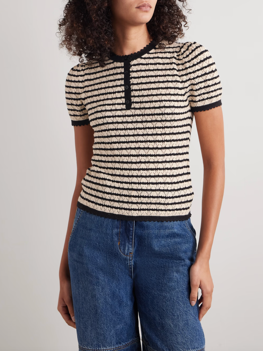 The Brandie striped pointelle-knit top by DÔEN blends cotton and silk for a soft, breathable feel. Its delicate pointelle-knit detailing and contrasting stripes add subtle texture and visual interest. Designed with a slightly loose fit, it features scalloped trims on the crew neckline, short sleeves, and hem for a refined finish.