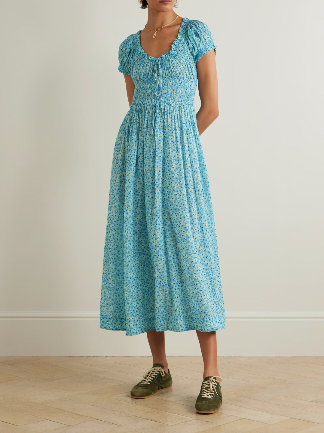 Inspired by the relaxed elegance of Southern California, this Ashlynn midi dress embodies DÔEN's signature romantic aesthetic. Crafted from breathable organic cotton-voile, it features an enchanting all-over floral print that captures effortless sophistication. The shirred bodice provides gentle shaping and comfort, while adjustable ties at the neckline and waist allow you to customize the fit to your preference.