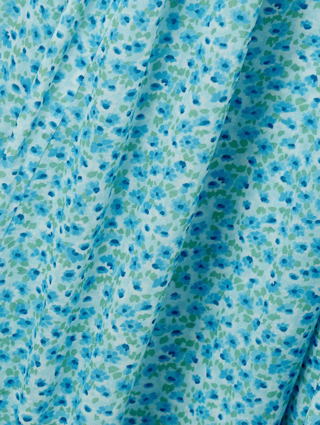 Inspired by the relaxed elegance of Southern California, this Ashlynn midi dress embodies DÔEN's signature romantic aesthetic. Crafted from breathable organic cotton-voile, it features an enchanting all-over floral print that captures effortless sophistication. The shirred bodice provides gentle shaping and comfort, while adjustable ties at the neckline and waist allow you to customize the fit to your preference.