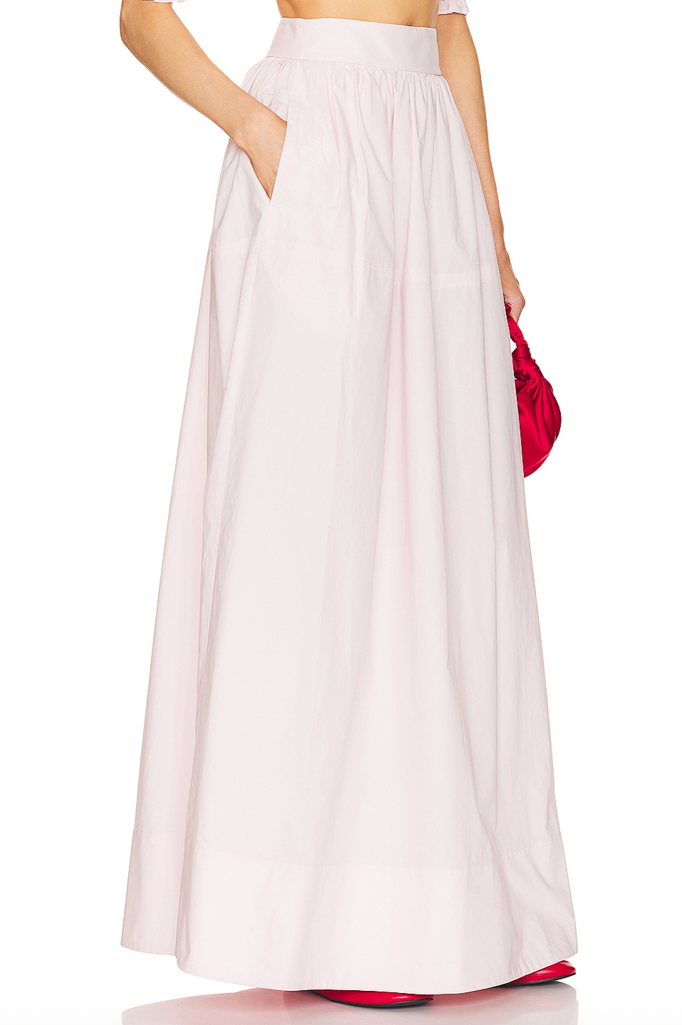 Crafted from 100% cotton lightweight poplin, this maxi skirt offers breathable comfort and a smooth drape. Designed with a hidden side zipper and side slip pockets, it combines practicality with a streamlined silhouette. The unlined construction enhances its light feel, making it ideal for warm weather wear. Note that this item is sold individually, allowing for versatile styling options. Machine washable for easy care, it delivers both function and refined simplicity.