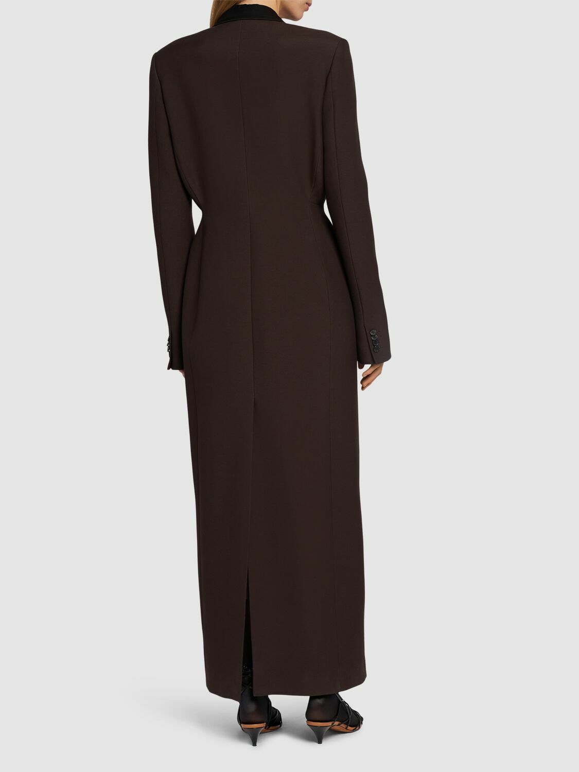 Elevate your outerwear collection with the Bellow Viscose Blend Long Coat by Khaite. Expertly crafted from a luxurious viscose blend, this coat features a clean front button closure and two practical front slit pockets for effortless functionality. Fully lined for comfort and durability, it offers a refined silhouette and timeless appeal, perfect for sophisticated layering in cooler seasons.