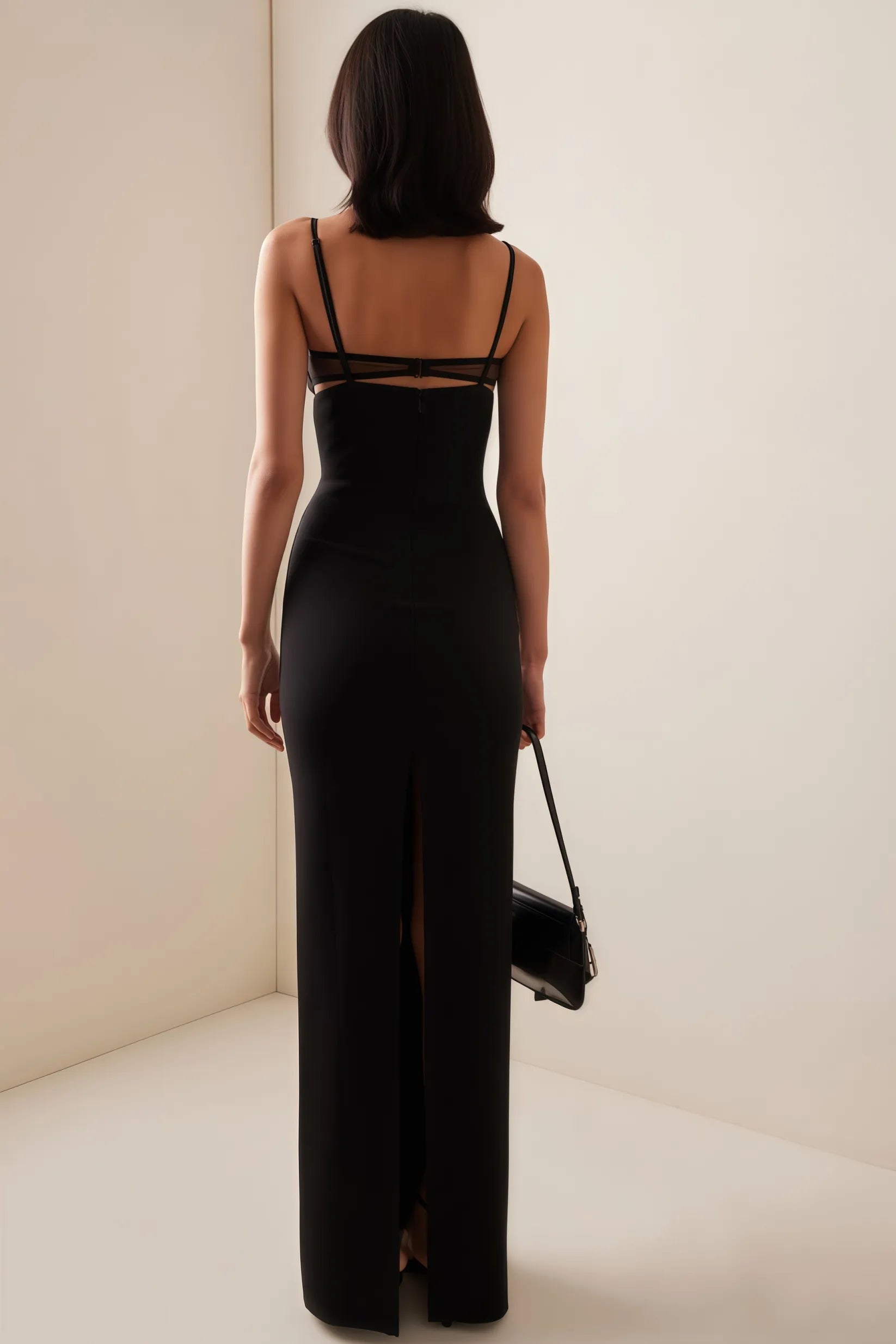 The Crepe Bustier Maxi Dress by Nensi Dojaka elegantly blends modern design with timeless glamour. Featuring a bustier-style top with a keyhole cutout, it accentuates the neckline while sculpting the waist. The fitted bodice flows into a fishtail skirt that hugs the thighs before flaring dramatically, creating an iconic silhouette. Ideal for red carpet events or formal occasions, this dress delivers a refined, high-fashion statement that highlights both sophistication and bold style.