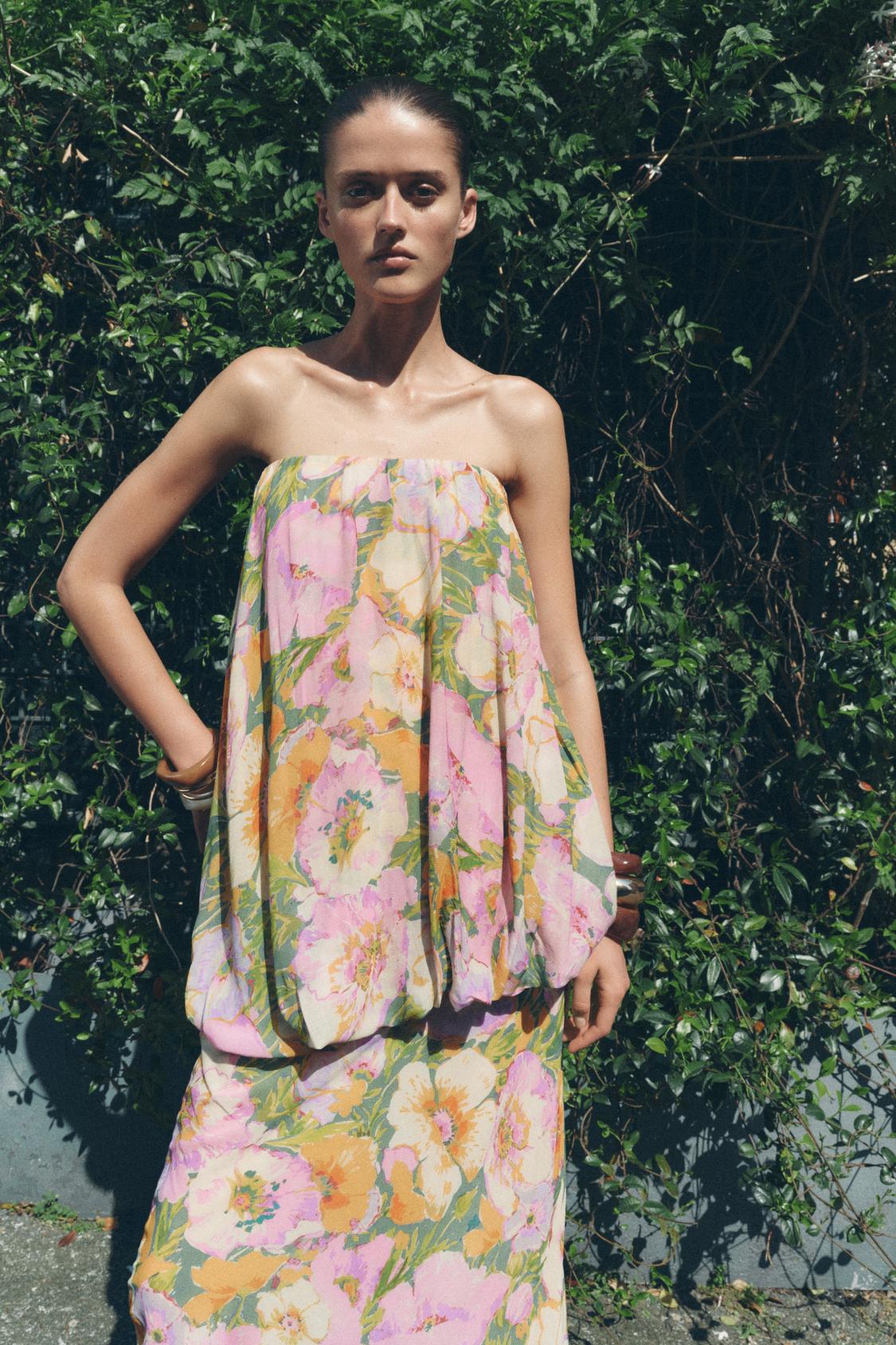 This Floral Print Dress features a straight-cut neckline and bare shoulders for a refined, elegant silhouette. The intricate floral print adds a delicate visual appeal, while the combined interior lining ensures comfort and structure. A concealed side zip with a metal hook provides a seamless finish, enhancing both fit and ease of wear. Ideal for sophisticated occasions, this dress balances style and practicality with expert tailoring.