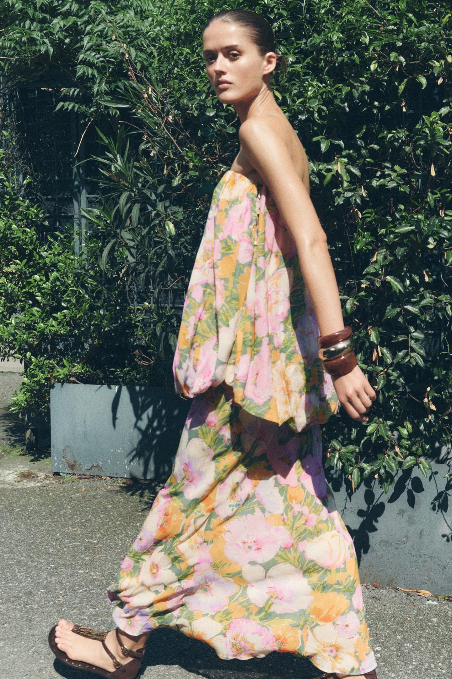 This Floral Print Dress features a straight-cut neckline and bare shoulders for a refined, elegant silhouette. The intricate floral print adds a delicate visual appeal, while the combined interior lining ensures comfort and structure. A concealed side zip with a metal hook provides a seamless finish, enhancing both fit and ease of wear. Ideal for sophisticated occasions, this dress balances style and practicality with expert tailoring.