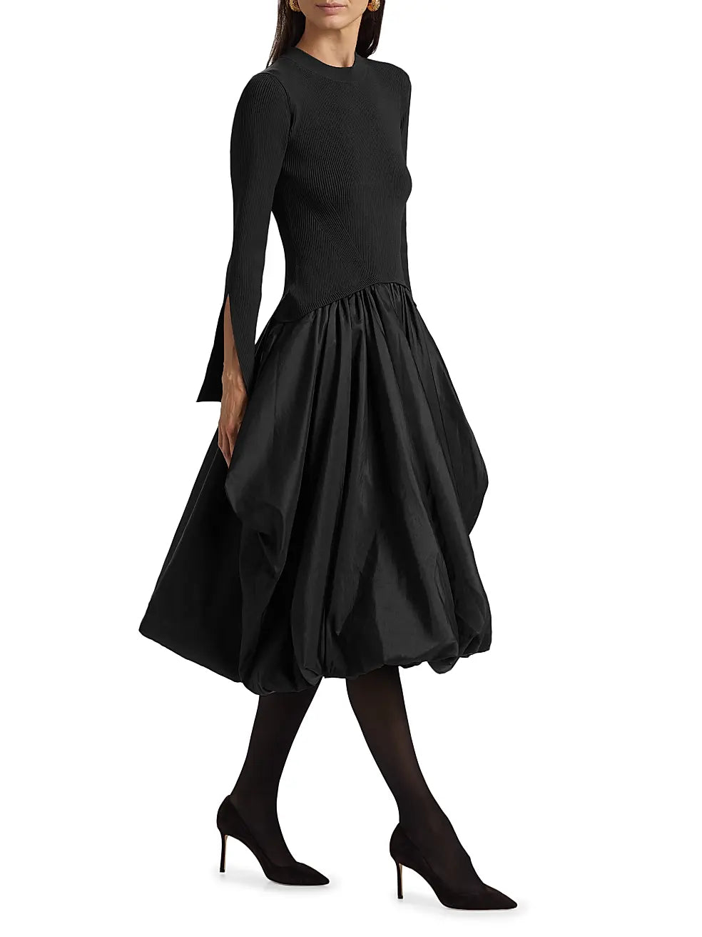 The Kenlie Mixed-Media Bubble Skirt Midi-Dress by SIMKHAI combines a sleek rib-knit top with a distinctive bubble skirt for a refined silhouette. It features a comfortable crewneck and elegant long split sleeves, enhancing both style and ease of movement. Designed to pull over effortlessly, this dress balances modern structure with feminine volume, making it a standout choice for sophisticated occasions.