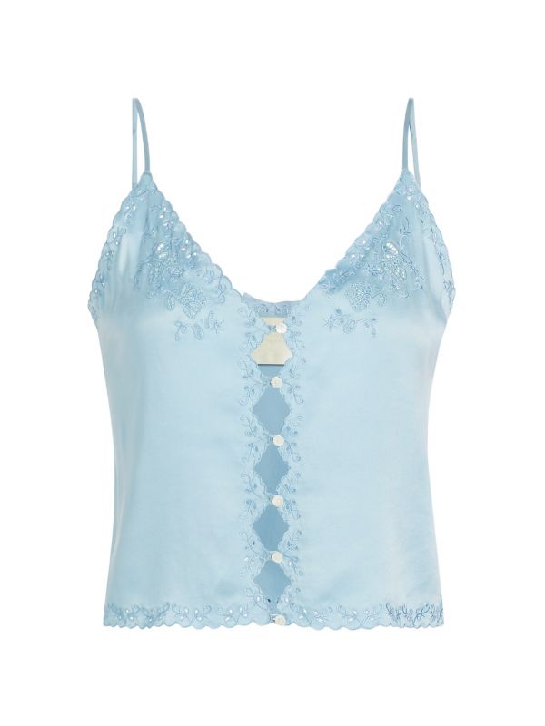 Crafted from 100% luxurious silk, the Elise Silk Crop Camisole by D Ô E N showcases a refined slip silhouette enhanced by openwork front buttons. Its delicate embroidered trim adds subtle elegance to the sleeveless design, while adjustable straps ensure a perfect fit. Featuring a flattering V-neck and tailored button-front closure, this piece combines comfort and sophistication. 