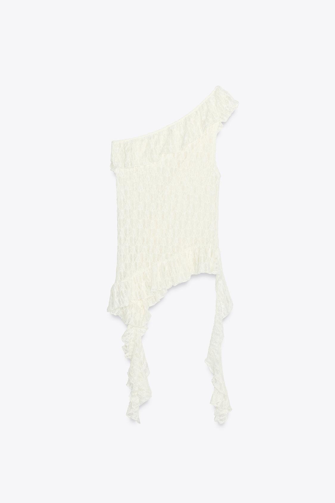 Elevate your wardrobe with the Asymmetric Lace Set, featuring a high-waisted semi-sheer long skirt that offers a comfortable fit with its elastic waistband. The semi-sheer top stands out with an asymmetric neckline and delicate ruffle detailing, adding a refined touch to the ensemble. This set balances elegance and subtle allure, perfect for sophisticated occasions where style and comfort are essential.