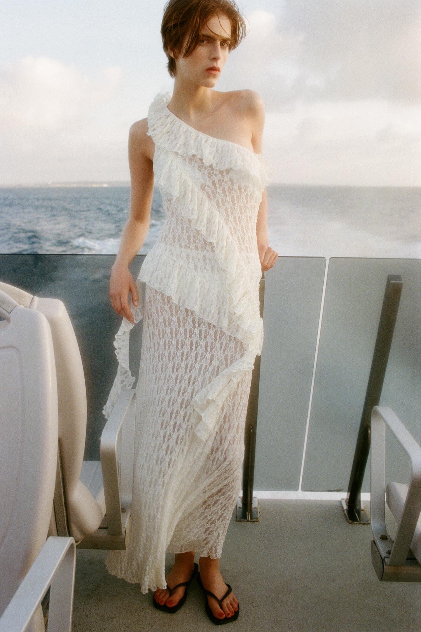 Elevate your wardrobe with the Asymmetric Lace Set, featuring a high-waisted semi-sheer long skirt that offers a comfortable fit with its elastic waistband. The semi-sheer top stands out with an asymmetric neckline and delicate ruffle detailing, adding a refined touch to the ensemble. This set balances elegance and subtle allure, perfect for sophisticated occasions where style and comfort are essential.