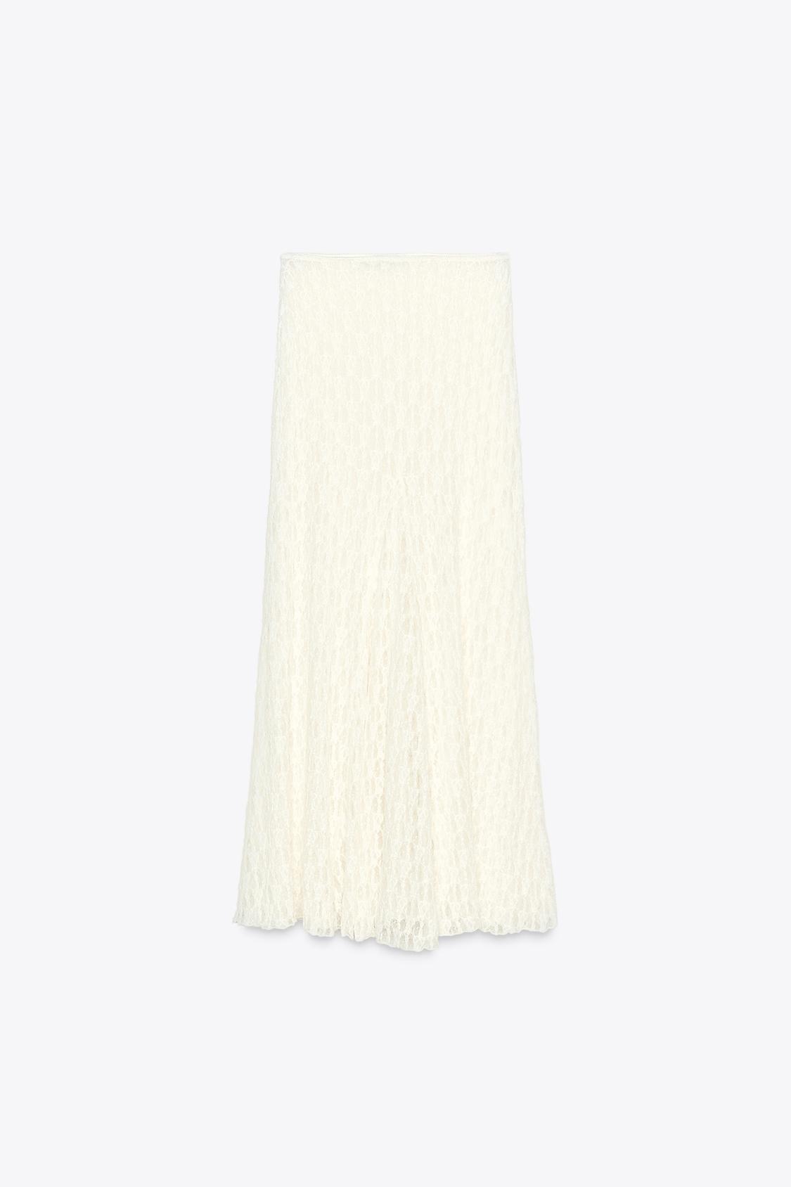 Elevate your wardrobe with the Asymmetric Lace Set, featuring a high-waisted semi-sheer long skirt that offers a comfortable fit with its elastic waistband. The semi-sheer top stands out with an asymmetric neckline and delicate ruffle detailing, adding a refined touch to the ensemble. This set balances elegance and subtle allure, perfect for sophisticated occasions where style and comfort are essential.