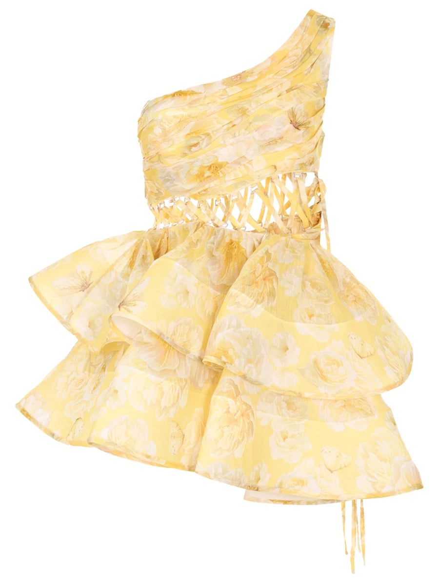 The Iris Dress by YVON is crafted from premium linen silk, showcasing an elegant yellow blend with a floral print inspired by fairy forest blossoms. Its handmade asymmetrical bodice defines femininity with subtle allure, while the waist lacing sculpts a striking silhouette. This dress balances romantic charm with sophisticated design for a truly unique statement piece.