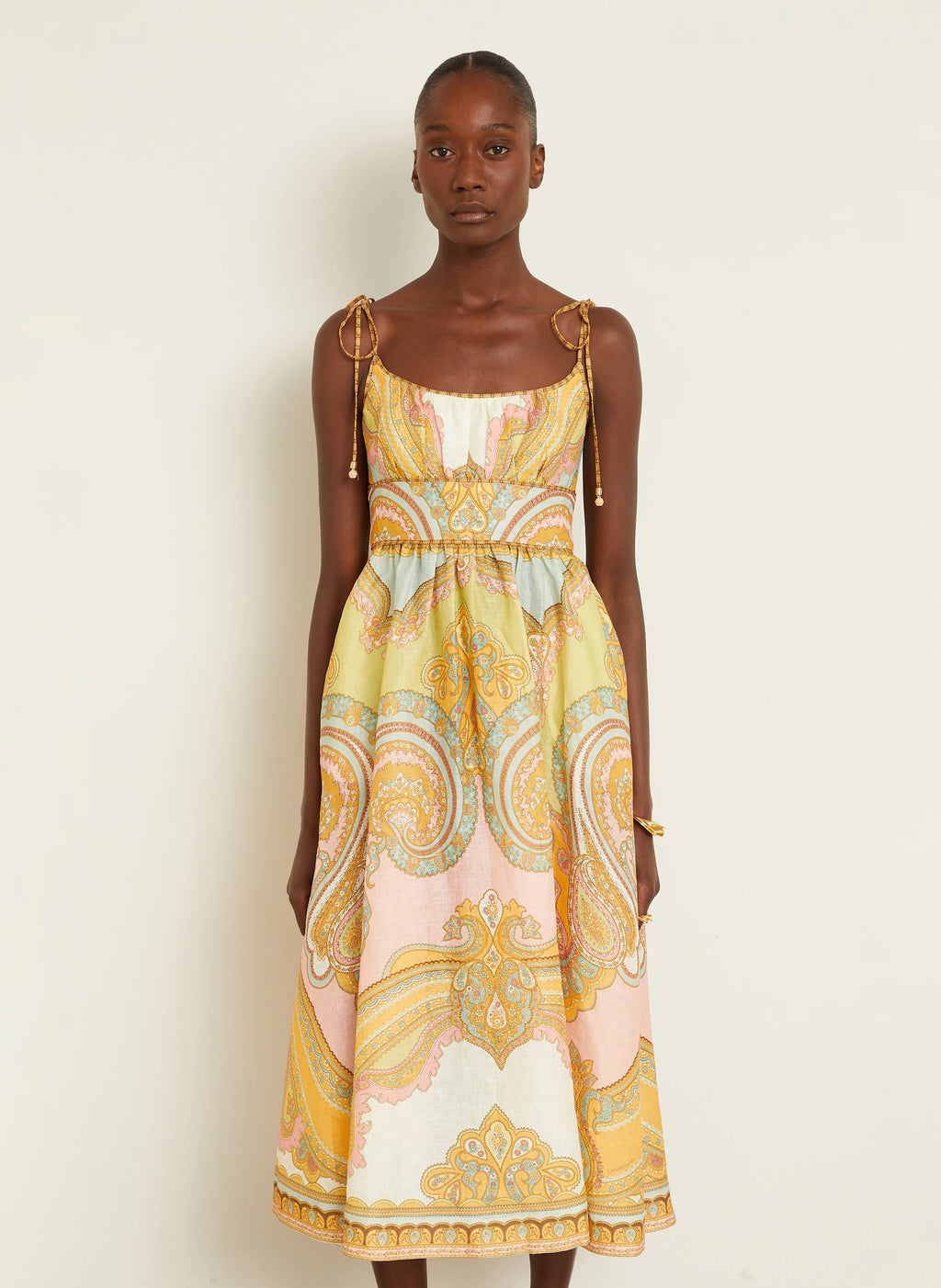 The Maxine Picnic Midi Dress by Zimmermann combines expert tailoring with breathable linen fabric for optimal comfort on warm days. Its boned bodice and smocked back provide a structured yet adaptable fit, while self-tie shoulder straps and a hidden back zipper maintain a sleek profile. Unlined for lightweight wear, this dress also includes practical side seam pockets, balancing functionality with refined style—ideal for sophisticated summer occasions.