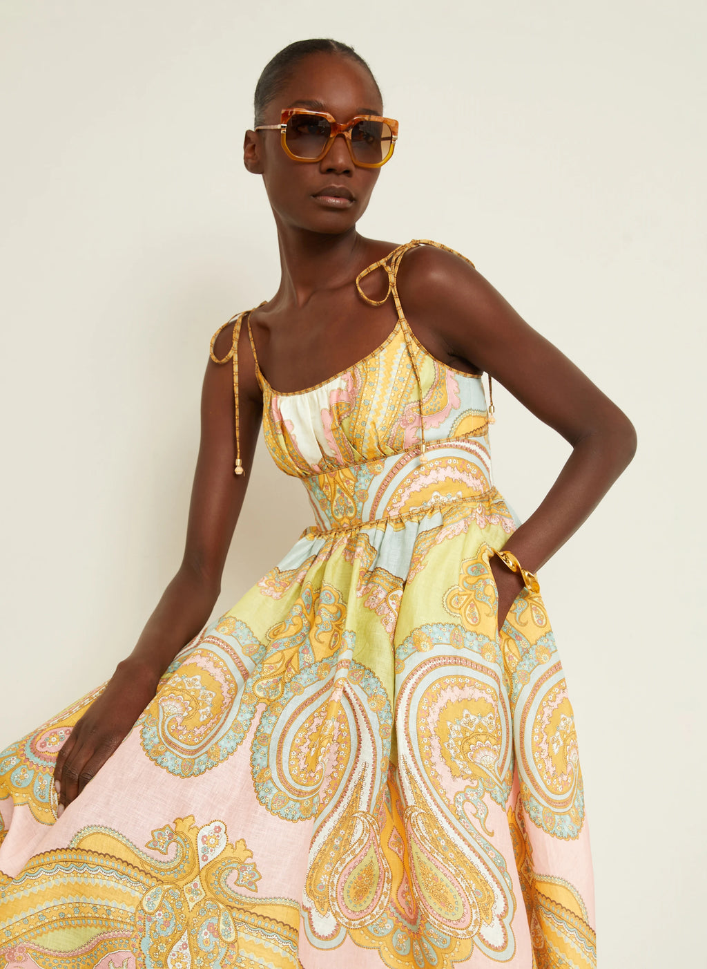 The Maxine Picnic Midi Dress by Zimmermann combines expert tailoring with breathable linen fabric for optimal comfort on warm days. Its boned bodice and smocked back provide a structured yet adaptable fit, while self-tie shoulder straps and a hidden back zipper maintain a sleek profile. Unlined for lightweight wear, this dress also includes practical side seam pockets, balancing functionality with refined style—ideal for sophisticated summer occasions.