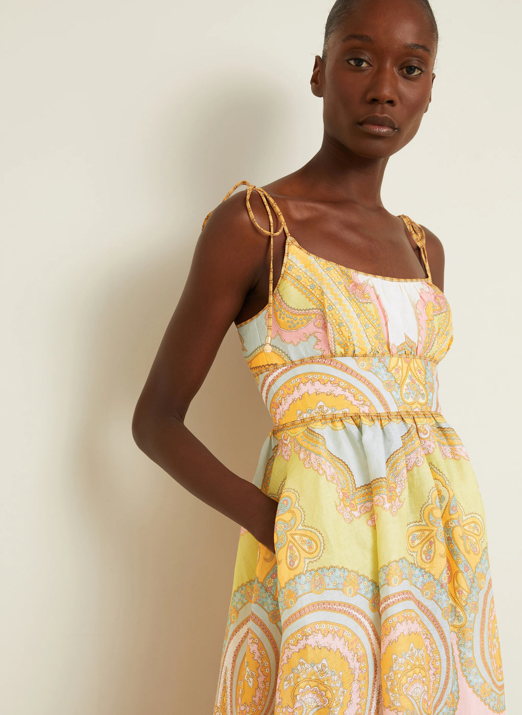 The Maxine Picnic Midi Dress by Zimmermann combines expert tailoring with breathable linen fabric for optimal comfort on warm days. Its boned bodice and smocked back provide a structured yet adaptable fit, while self-tie shoulder straps and a hidden back zipper maintain a sleek profile. Unlined for lightweight wear, this dress also includes practical side seam pockets, balancing functionality with refined style—ideal for sophisticated summer occasions.