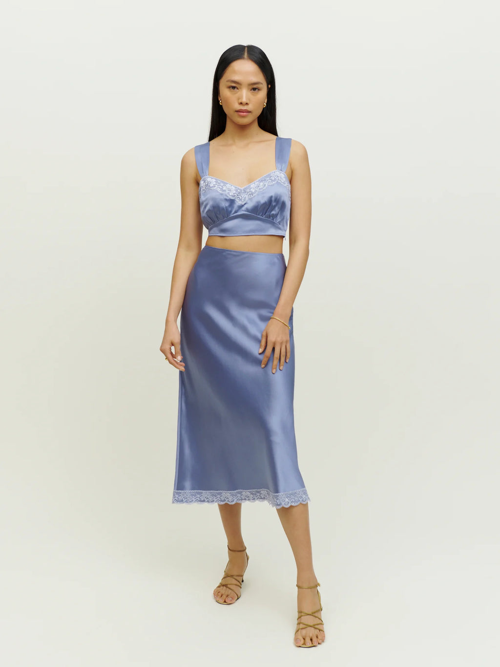 Reformation’s Beatrice Silk Set exemplifies sustainable luxury, crafted from eco-friendly materials that honor both style and the environment. This set features premium silk sourced responsibly, ensuring a soft, breathable feel while minimizing ecological impact. Designed with the modern wardrobe in mind, it balances timeless elegance with conscious production practices, from climate-neutral manufacturing to transparent sourcing. 