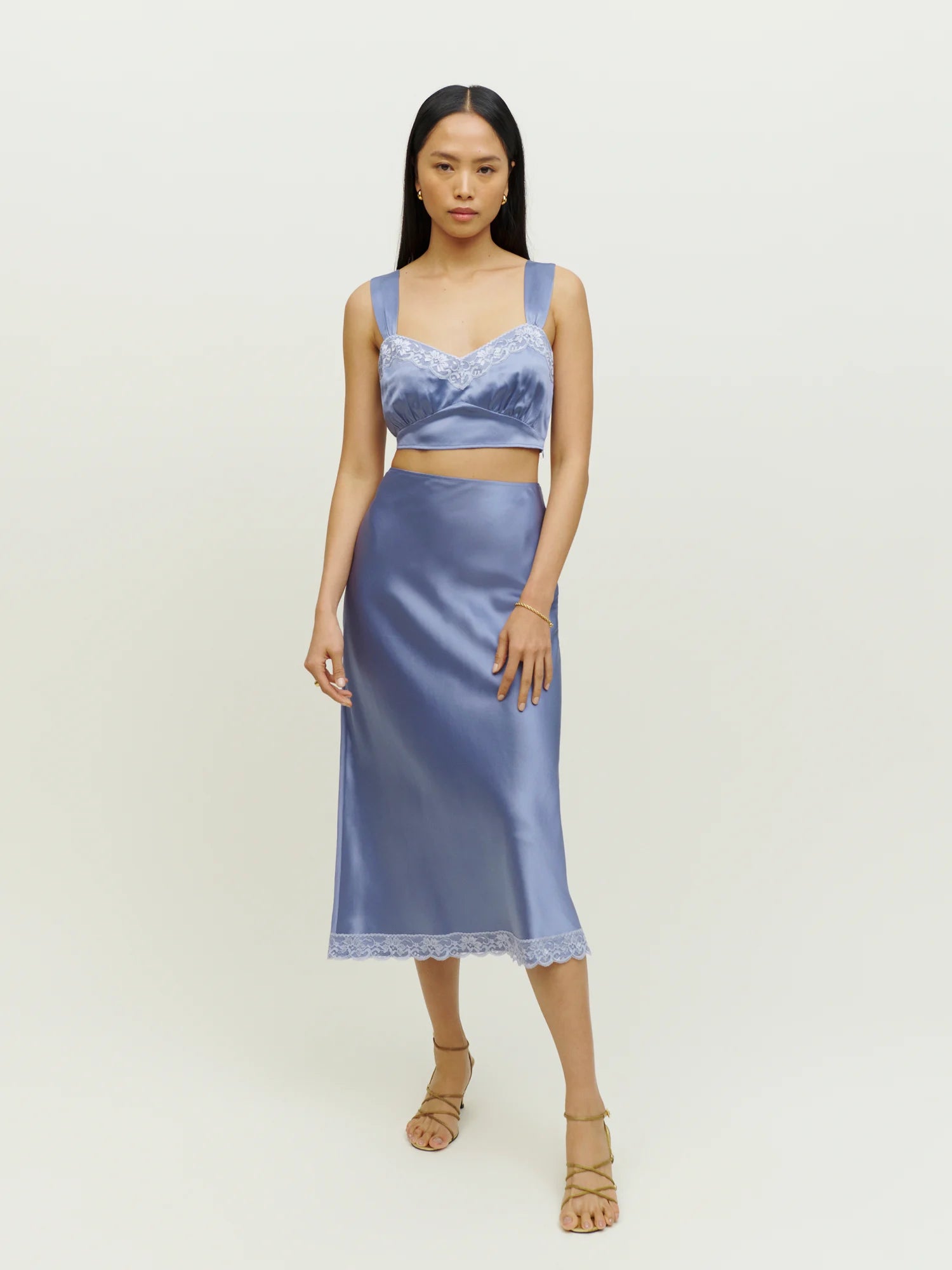 Reformation’s Beatrice Silk Set exemplifies sustainable luxury, crafted from eco-friendly materials that honor both style and the environment. This set features premium silk sourced responsibly, ensuring a soft, breathable feel while minimizing ecological impact. Designed with the modern wardrobe in mind, it balances timeless elegance with conscious production practices, from climate-neutral manufacturing to transparent sourcing. 