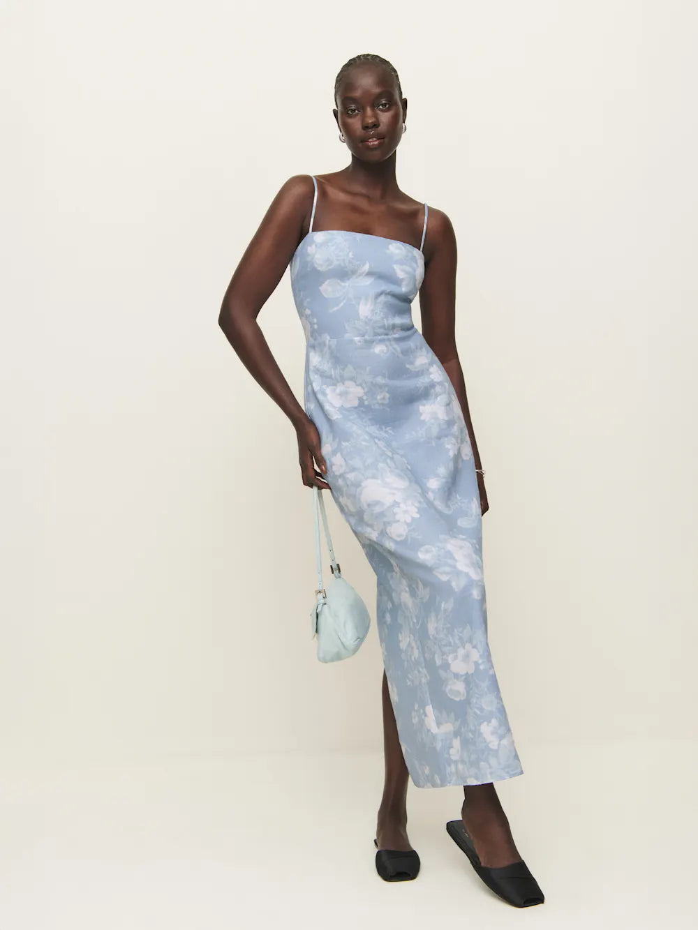 The Frankie Linen Dress by Reformation features a slim silhouette that flatters your figure with its straight neckline and sleek, non-adjustable spaghetti straps for a secure fit. Crafted with attention to detail, it includes a subtle center back slit that enhances mobility and adds a refined touch. Ideal for warm weather, its breathable linen fabric ensures comfort while maintaining a polished, sophisticated look. Perfect for elegant daytime events or casual evening outings.