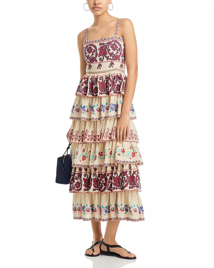 The Ramona Embroidered Dress by SEA New York showcases a sophisticated fit-and-flare silhouette with a flattering square neckline and secure back zip closure. Delicate embroidery adorns the entire dress, enhancing its refined appeal, while the tiered ruffle skirt adds movement and dimension. Designed with straps and fully lined for comfort, this piece combines elegance with thoughtful construction. Crafted in India, it exemplifies skilled artistry and attention to detail.
