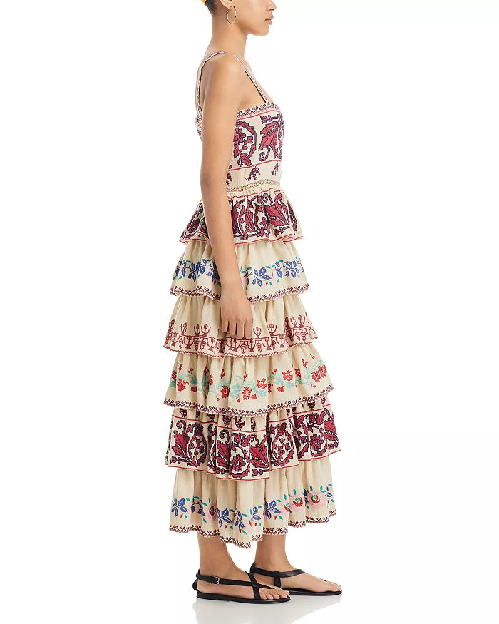 The Ramona Embroidered Dress by SEA New York showcases a sophisticated fit-and-flare silhouette with a flattering square neckline and secure back zip closure. Delicate embroidery adorns the entire dress, enhancing its refined appeal, while the tiered ruffle skirt adds movement and dimension. Designed with straps and fully lined for comfort, this piece combines elegance with thoughtful construction. Crafted in India, it exemplifies skilled artistry and attention to detail.