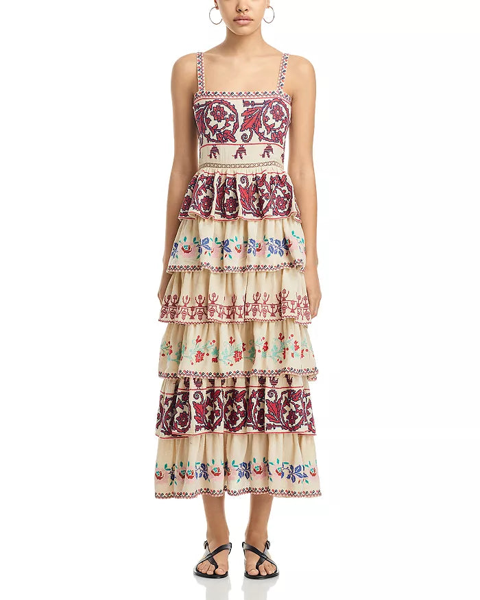 The Ramona Embroidered Dress by SEA New York showcases a sophisticated fit-and-flare silhouette with a flattering square neckline and secure back zip closure. Delicate embroidery adorns the entire dress, enhancing its refined appeal, while the tiered ruffle skirt adds movement and dimension. Designed with straps and fully lined for comfort, this piece combines elegance with thoughtful construction. Crafted in India, it exemplifies skilled artistry and attention to detail.