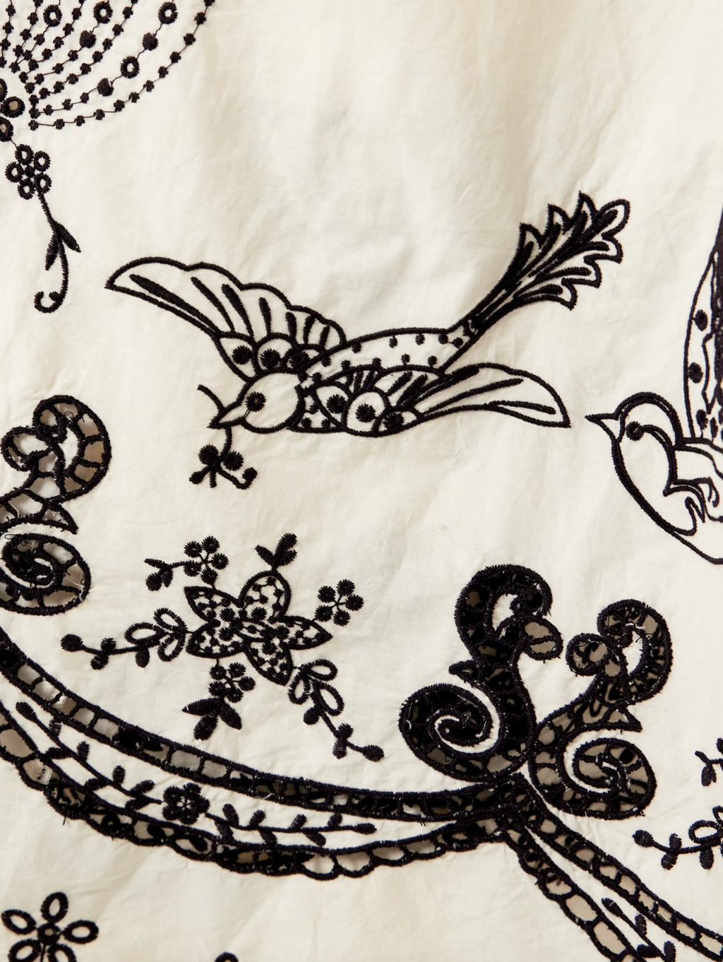 The Kingsley embroidered cotton midi dress by SEA NY showcases delicate pleats that elegantly fan out to reveal intricate embroidered birds, flowers, and garlands. Crafted from breathable cotton, it features broderie anglaise cutouts along the hem, adding refined detail and enhancing its airy, sophisticated appeal—ideal for warm-weather occasions requiring both comfort and expert design.