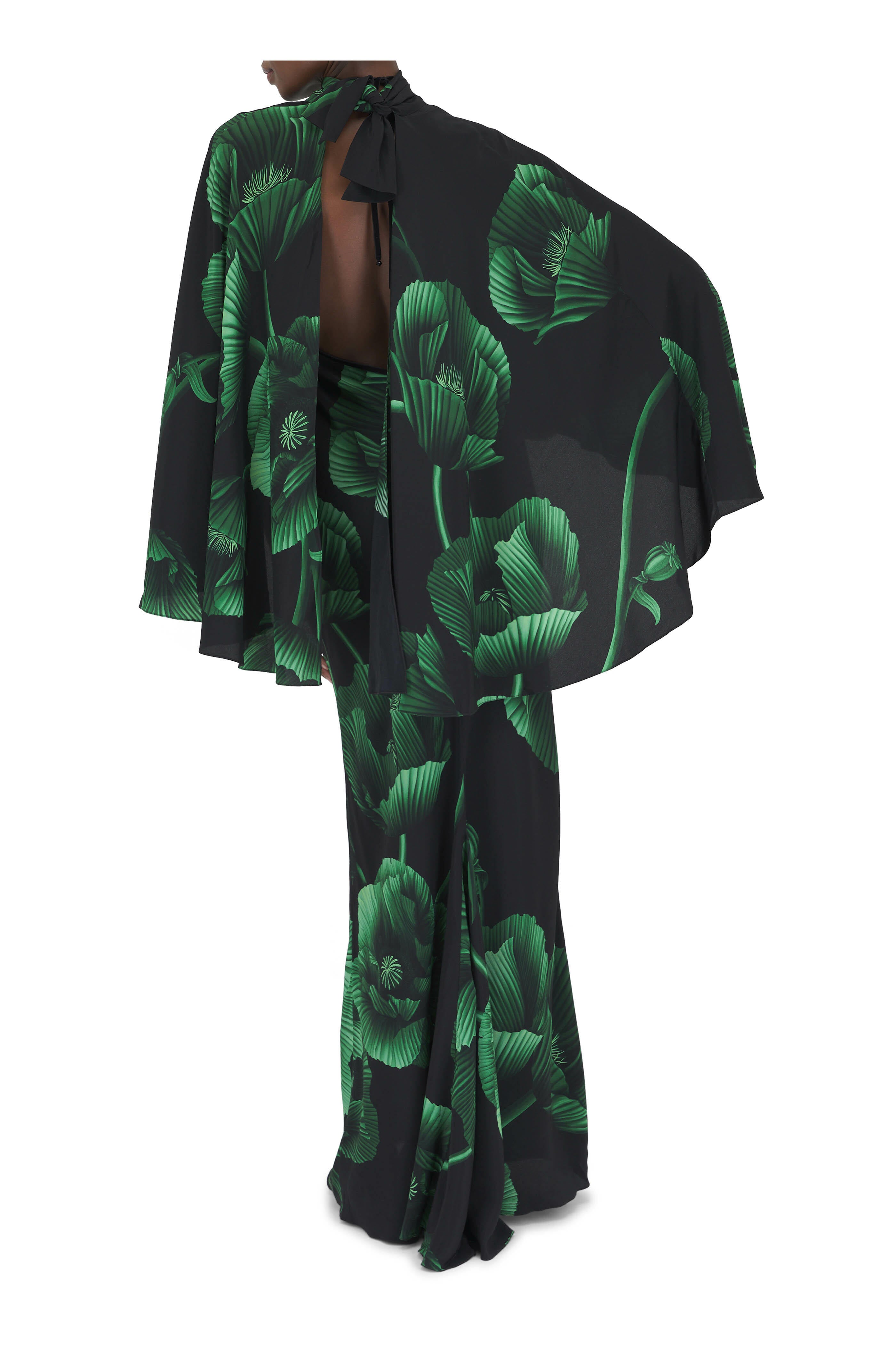 Elevate your wardrobe with the Simple Opulence Green Floral Maxi Dress by Johanna Ortiz. This expertly crafted dress features a flowing silhouette adorned with delicate green floral patterns, combining refined elegance with a touch of natural vibrancy. Its lightweight fabric ensures comfort and grace from day to night, making it an ideal choice for sophisticated occasions or elevated everyday wear. The design reflects timeless style, offering an effortless way to showcase understated luxury.