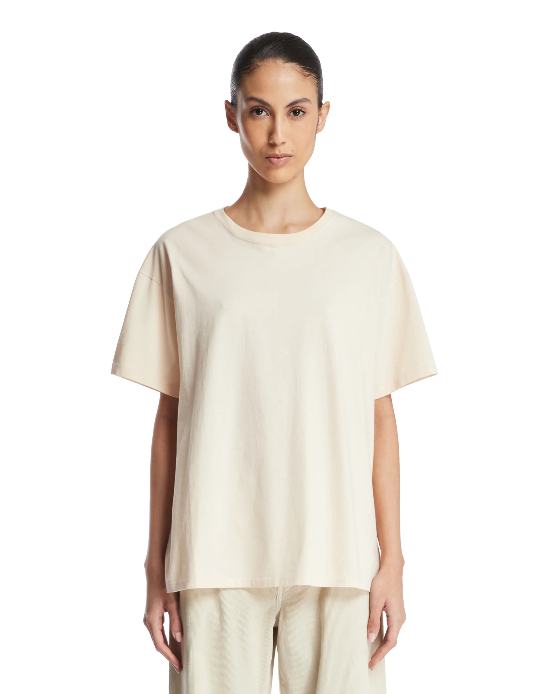 The Beige Nadina Oversized T-shirt from The Row combines effortless style and comfort. Crafted from soft beige cotton, it features a classic crew neckline, short sleeves, and a straight hem for a clean silhouette. Its oversized fit is thoughtfully enhanced with ribbed details, adding subtle texture and structure. This versatile piece offers a relaxed yet refined look, ideal for layering or wearing alone with ease.
