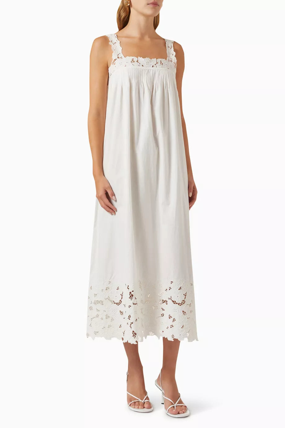 The Ellen Dress in Cotton by DÔEN blends sustainable design with refined craftsmanship. Made from GOTS-certified organic cotton, it offers a breathable, lightweight feel perfect for warm days. Hand-placed floral embroidery adds delicate detail, enhancing its ethereal appeal. Designed with an airy fit, this dress ensures comfort and effortless style, ideal for spontaneous outings or relaxed occasions.