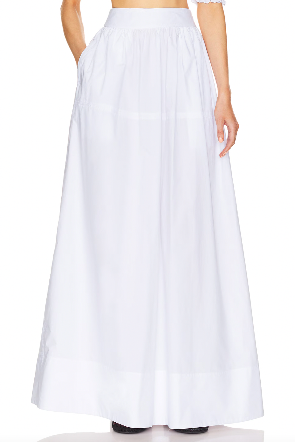 Crafted from 100% cotton lightweight poplin, this maxi skirt offers breathable comfort and a smooth drape. Designed with a hidden side zipper and side slip pockets, it combines practicality with a streamlined silhouette. The unlined construction enhances its light feel, making it ideal for warm weather wear. Note that this item is sold individually, allowing for versatile styling options. Machine washable for easy care, it delivers both function and refined simplicity.