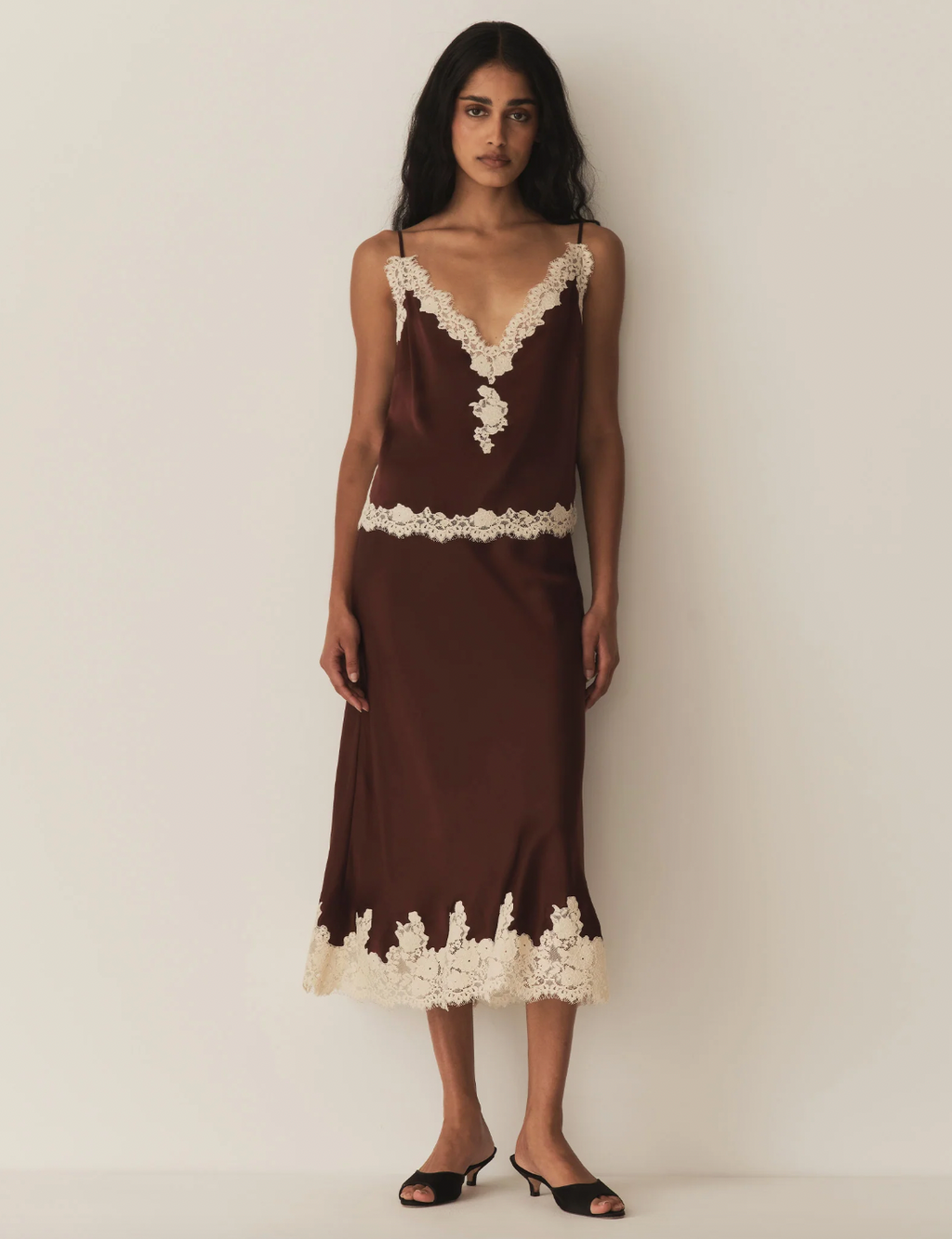 Experience refined elegance with the Kira corded lace-trimmed silk-satin camisole from DÔEN. Crafted from smooth silk-satin, it offers a luxurious feel against the skin, while the delicate corded lace adds an intricate, sophisticated detail. This camisole blends timeless design with a flattering fit, making it an ideal layering piece or statement alone for both day and evening wear. Its breathable fabric ensures comfort, enhancing your wardrobe with understated luxury.