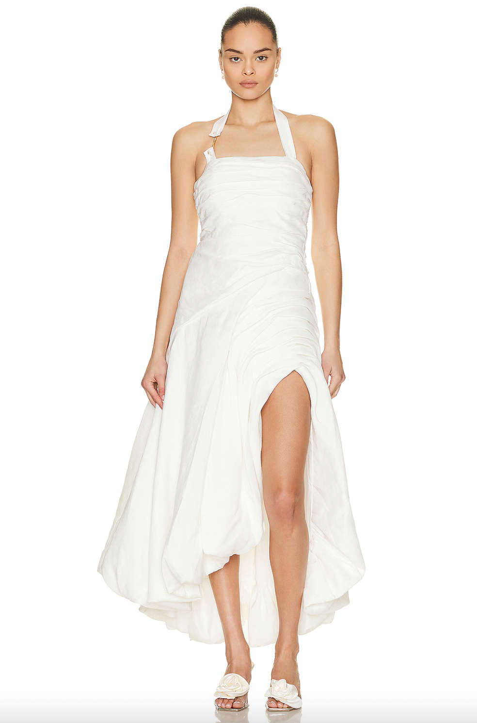 Elevate your wardrobe with the Mika Draped Split Midi Dress by Aje. Made from mid-weight ruched linen and fully lined for comfort, this dress features an asymmetrical hem that moves elegantly with every step. An exposed back zipper offers a contemporary touch, complemented by gold-tone and faux pearl details on the halter-neck strap, creating a sophisticated look ideal for formal occasions. This dress blends timeless design with expert craftsmanship for a polished, refined presence.