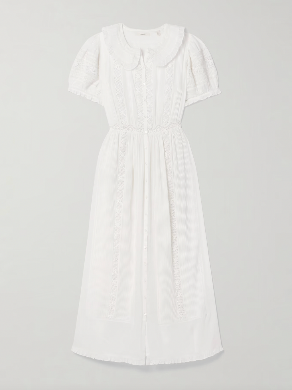 The Phoebe cotton-voile midi dress by DÔEN combines vintage charm with sustainable design. Crafted from organic cotton-voile, it features delicate lace trims and a classic Peter Pan collar. The dress gently cinches at the waist before flowing into a soft, floaty skirt, complemented by subtly puffed sleeves. This piece offers a refined, romantic silhouette ideal for those seeking timeless elegance with eco-conscious materials.