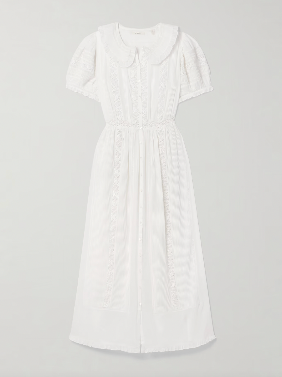 The Phoebe cotton-voile midi dress by DÔEN combines vintage charm with sustainable design. Crafted from organic cotton-voile, it features delicate lace trims and a classic Peter Pan collar. The dress gently cinches at the waist before flowing into a soft, floaty skirt, complemented by subtly puffed sleeves. This piece offers a refined, romantic silhouette ideal for those seeking timeless elegance with eco-conscious materials.