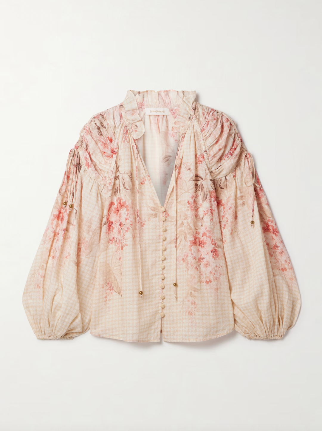 The Illuminate gathered printed ramie blouse by Zimmermann is crafted from breathable ramie fabric, offering natural comfort and durability. Its elegant gathered design enhances silhouette and movement, while the refined print adds a sophisticated touch. Ideal for both casual and dressier occasions, this blouse seamlessly combines airy texture with distinctive style.