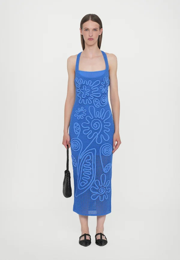 Elevate your wardrobe with the Nissa Dress in Capri by Cult Gaia, featuring a sophisticated sleeveless midi silhouette. Crafted with a delicate netting body, it is beautifully adorned with a detailed floral cord overlay for a refined texture and visual interest. Fully lined with a mini slip, this dress ensures comfortable coverage and ease of wear. Its effortless pull-on design offers convenience without compromising style, making it an ideal choice for elegant day or evening occasions.