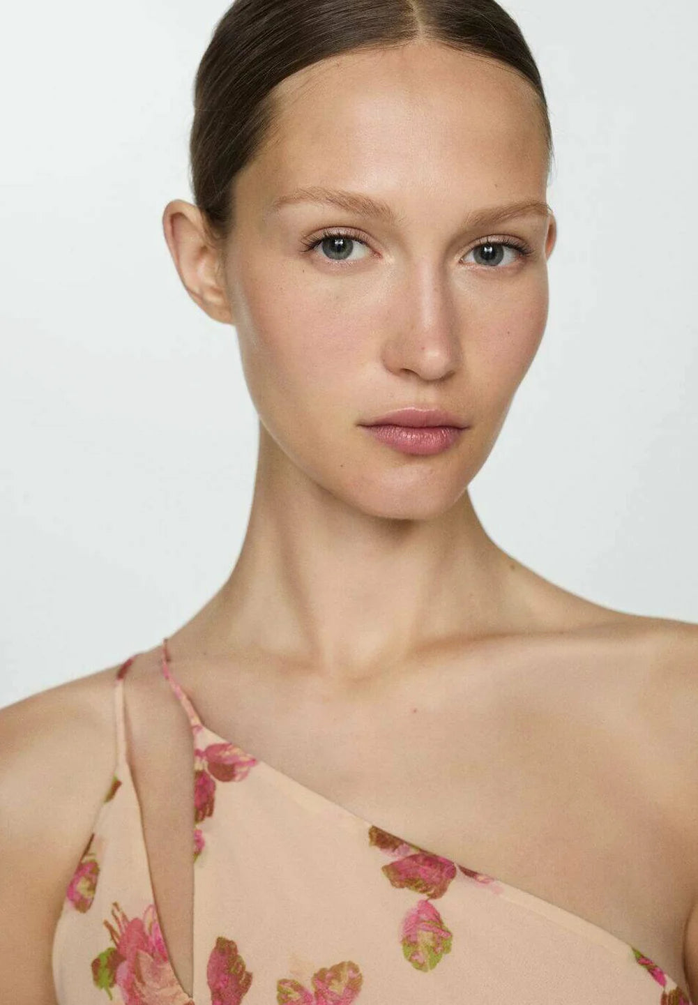 The Floral Slip Maxi Dress offers an elegant silhouette with its flowing maxi length and delicate floral pattern. Crafted for comfort and style, this dress features thin straps and a slip design that drapes gracefully over the body. Ideal for warm weather or layered in cooler seasons, it combines versatility with a timeless aesthetic perfect for both casual outings and special occasions.