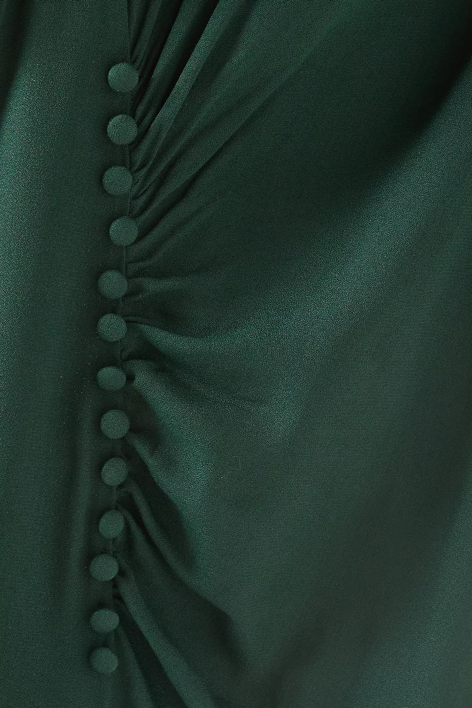 The Frasier Dress by Reformation, crafted in Los Angeles, embodies sustainable sophistication. Its crew neckline and cap sleeves frame a sleek slim silhouette enhanced by an off-center button detail. The high slit adds refined modernity, balancing style and eco-conscious design. This midi dress is perfect for those who demand elegance while supporting responsible fashion.