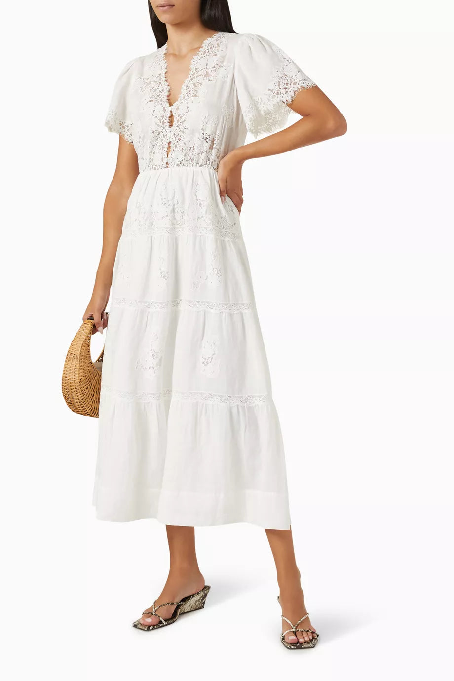 Embrace effortless elegance with the Graciella Lace-trim Maxi Dress by Doen, expertly crafted from breathable ramie fabric. The refined silhouette features a structured bodice that flatters your frame, flowing into a graceful A-line skirt that moves beautifully with every step. Delicate lace trim adds a touch of sophistication, making this versatile piece perfect for warm-weather occasions—from intimate gatherings to outdoor celebrations. A timeless investment piece that transcends seasons.