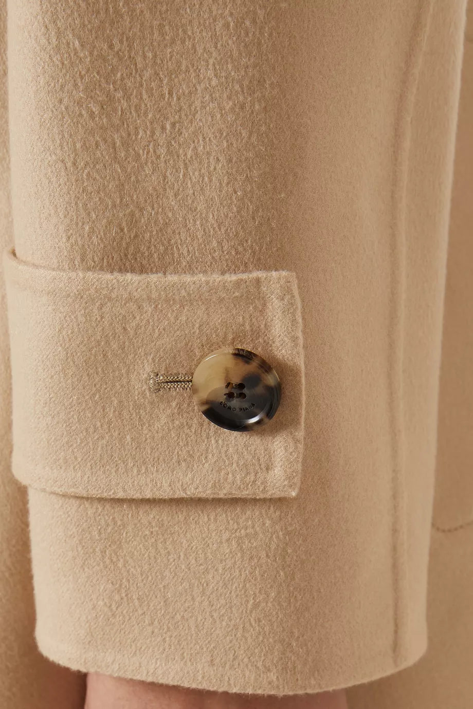 The Freddy Coat in Cashmere by Loro Piana is a masterclass in refined outerwear. Its innovative double construction technique creates a garment that is remarkably warm yet surprisingly lightweight. The double-breasted silhouette adds a classic touch, making it ideal for sophisticated layering. Perfectly suited for pairing with tailored trousers and ankle boots, this coat elevates any ensemble with enduring elegance and comfort.