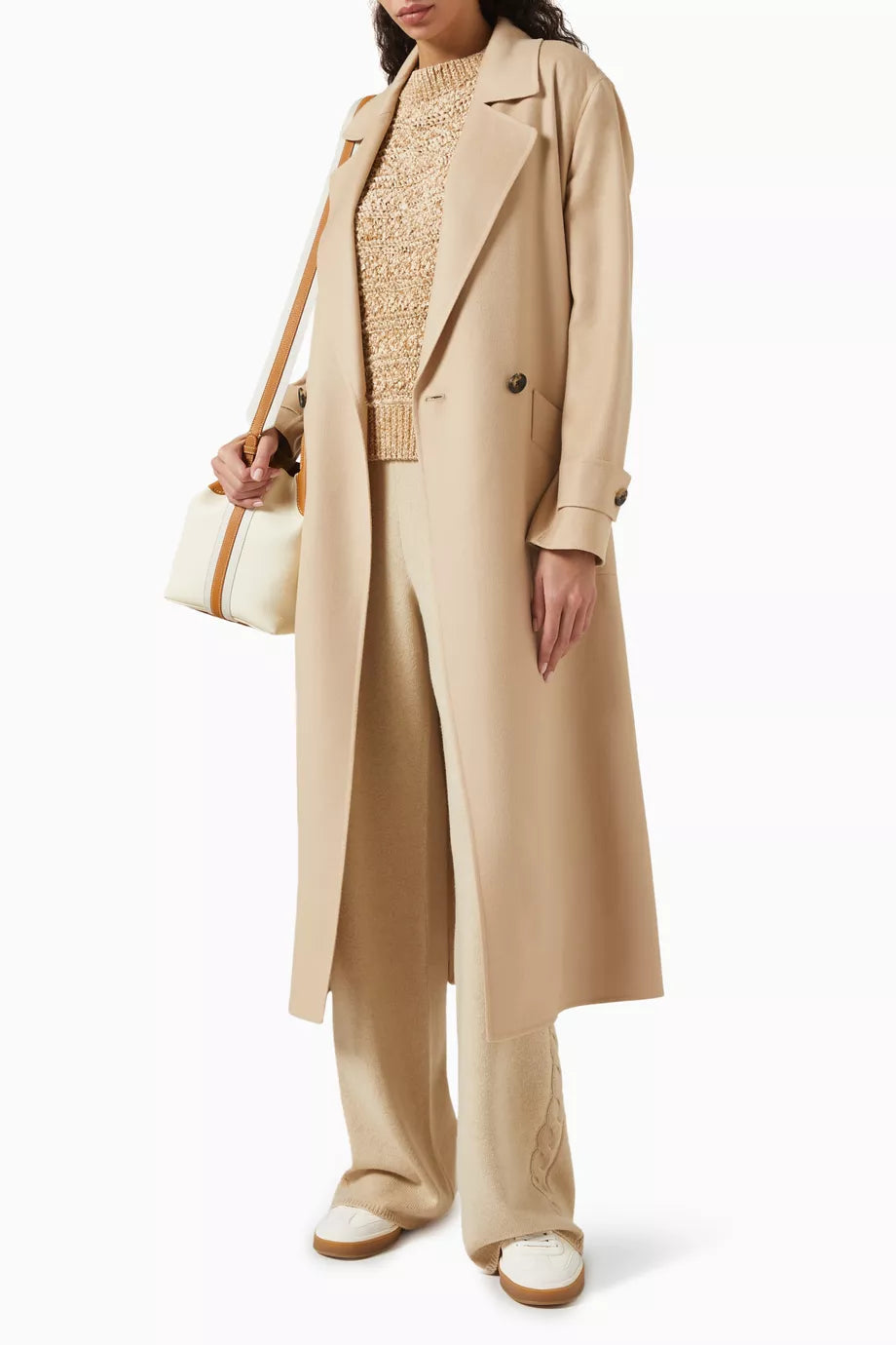 The Freddy Coat in Cashmere by Loro Piana is a masterclass in refined outerwear. Its innovative double construction technique creates a garment that is remarkably warm yet surprisingly lightweight. The double-breasted silhouette adds a classic touch, making it ideal for sophisticated layering. Perfectly suited for pairing with tailored trousers and ankle boots, this coat elevates any ensemble with enduring elegance and comfort.