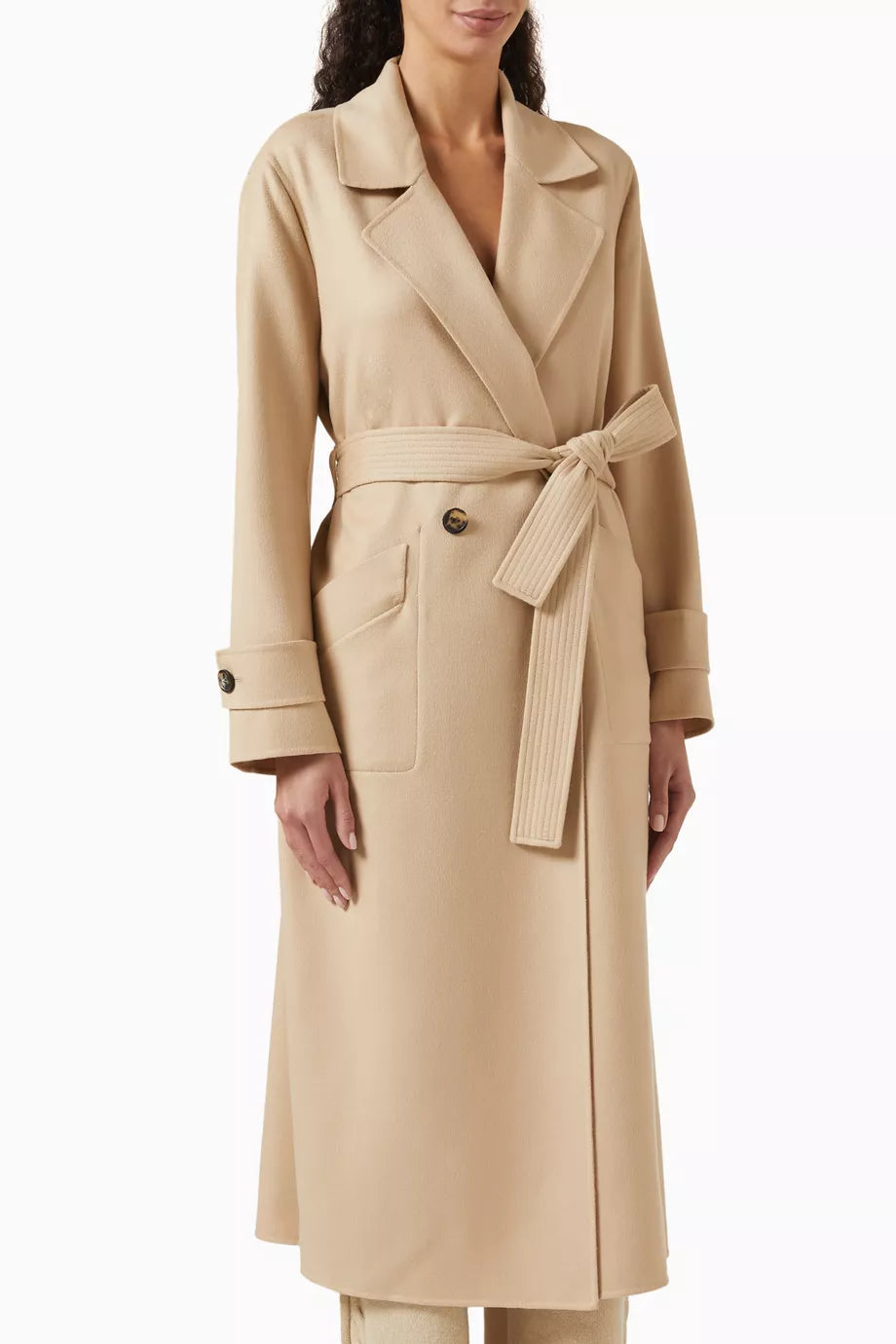 The Freddy Coat in Cashmere by Loro Piana is a masterclass in refined outerwear. Its innovative double construction technique creates a garment that is remarkably warm yet surprisingly lightweight. The double-breasted silhouette adds a classic touch, making it ideal for sophisticated layering. Perfectly suited for pairing with tailored trousers and ankle boots, this coat elevates any ensemble with enduring elegance and comfort.