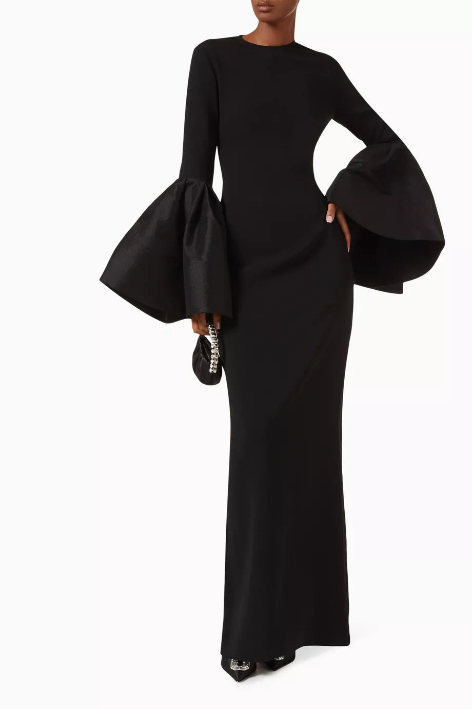 The Suri Flare-sleeve Maxi Dress by Solace London is expertly tailored for elegance and movement. Its dramatic flared cuffs create a striking silhouette, perfect for upscale occasions, while the rear slit offers both style and ease of movement, allowing you to navigate social settings with confidence and grace.