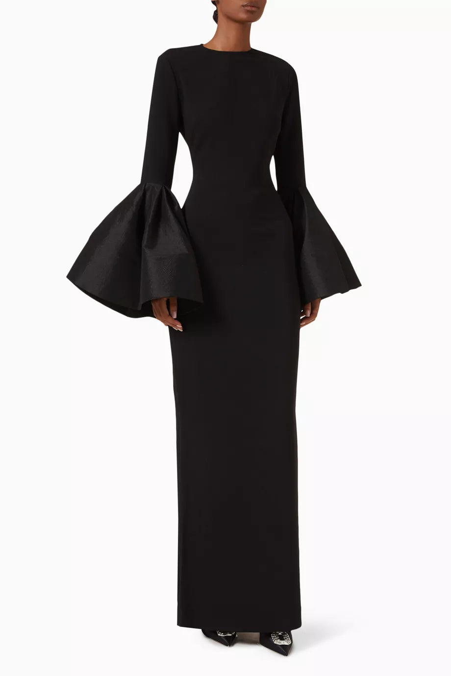The Suri Flare-sleeve Maxi Dress by Solace London is expertly tailored for elegance and movement. Its dramatic flared cuffs create a striking silhouette, perfect for upscale occasions, while the rear slit offers both style and ease of movement, allowing you to navigate social settings with confidence and grace.